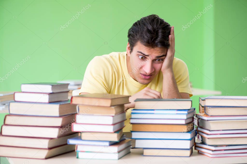 Student with too many books to read before exam