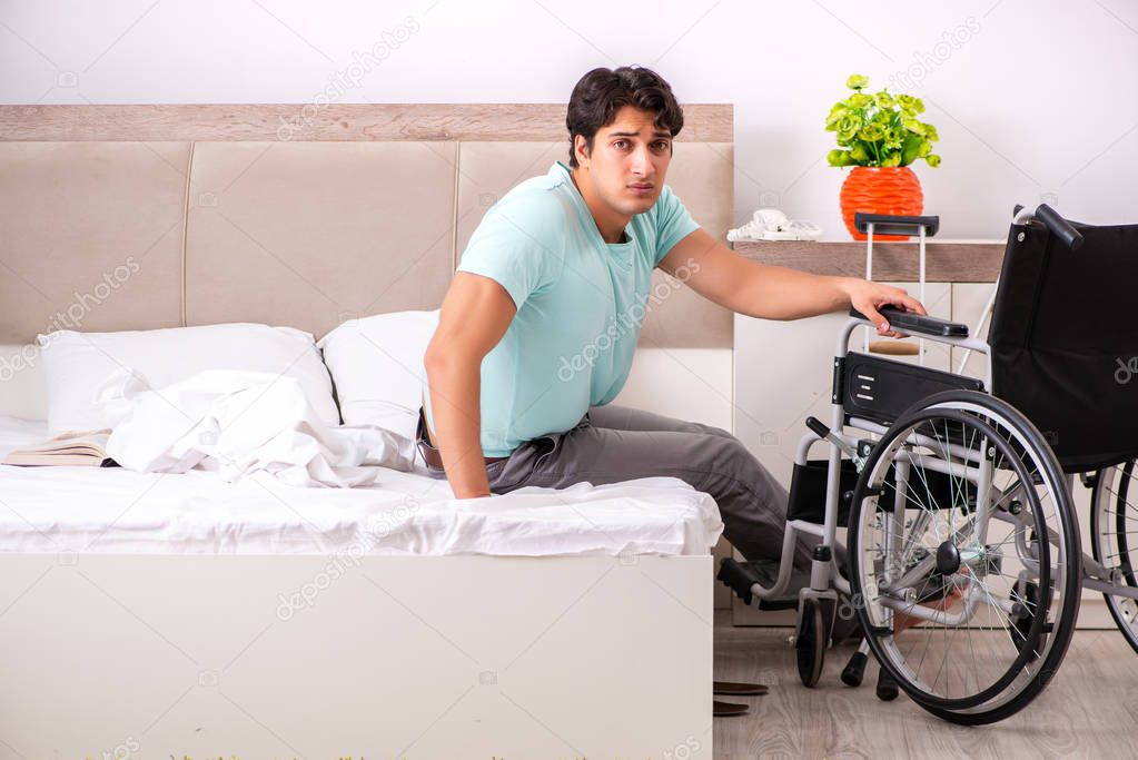 Young handsome disabled man recovering at home 