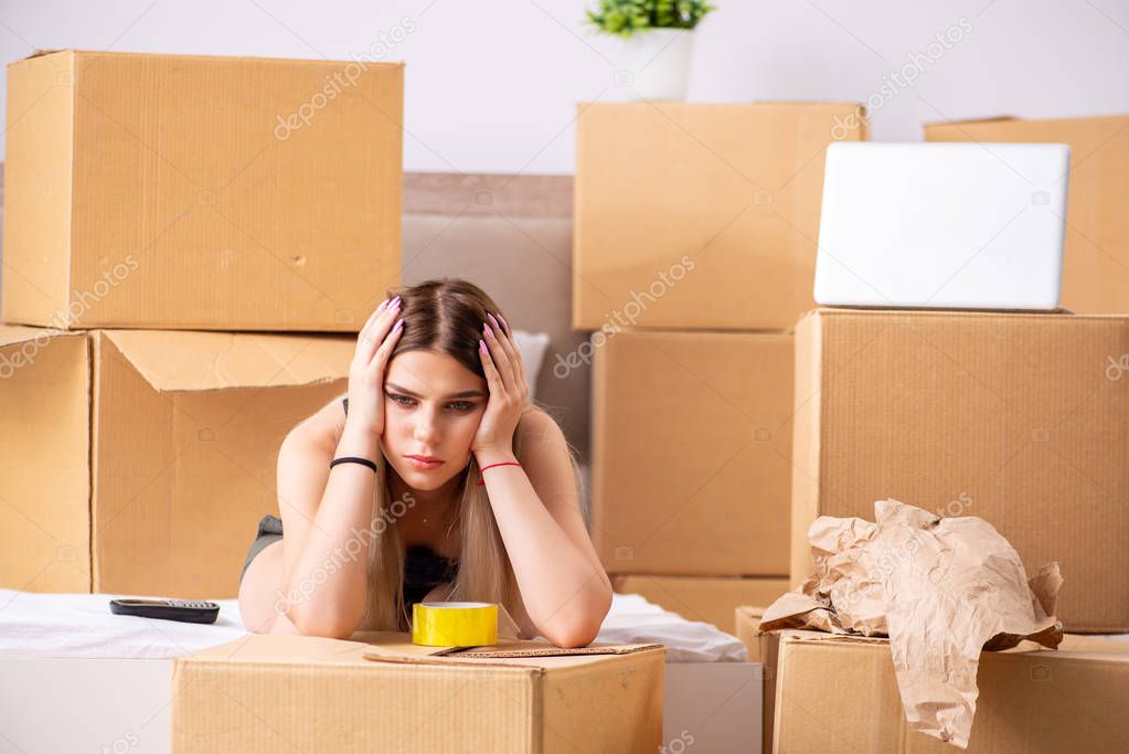 Young woman moving to new place