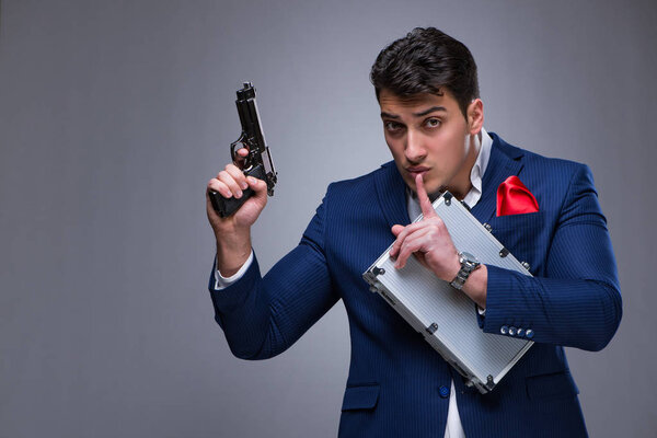 Handsome man against gray background