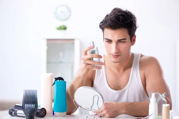 Young handsome man staring in the mirror — Stock Photo, Image