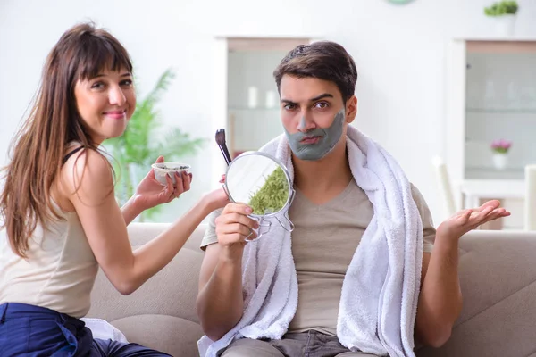 Handsome applying clay mask on face — Stock Photo, Image