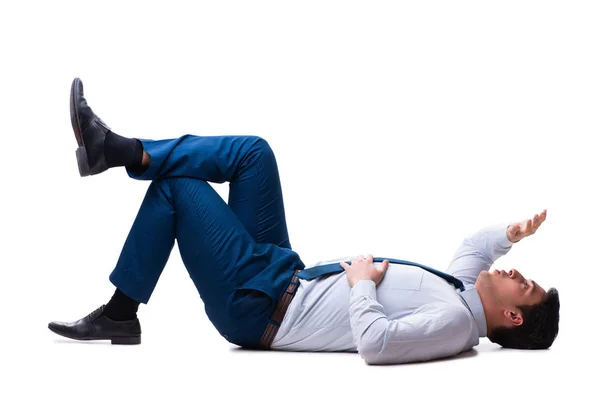 Uomo d'affari sdraiato sul pavimento isolato su bianco — Foto Stock