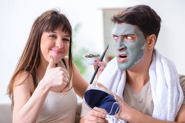 Handsome applying clay mask on face — Stock Photo, Image