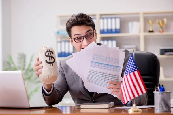 Businessman with American flag in office — Stock Photo, Image