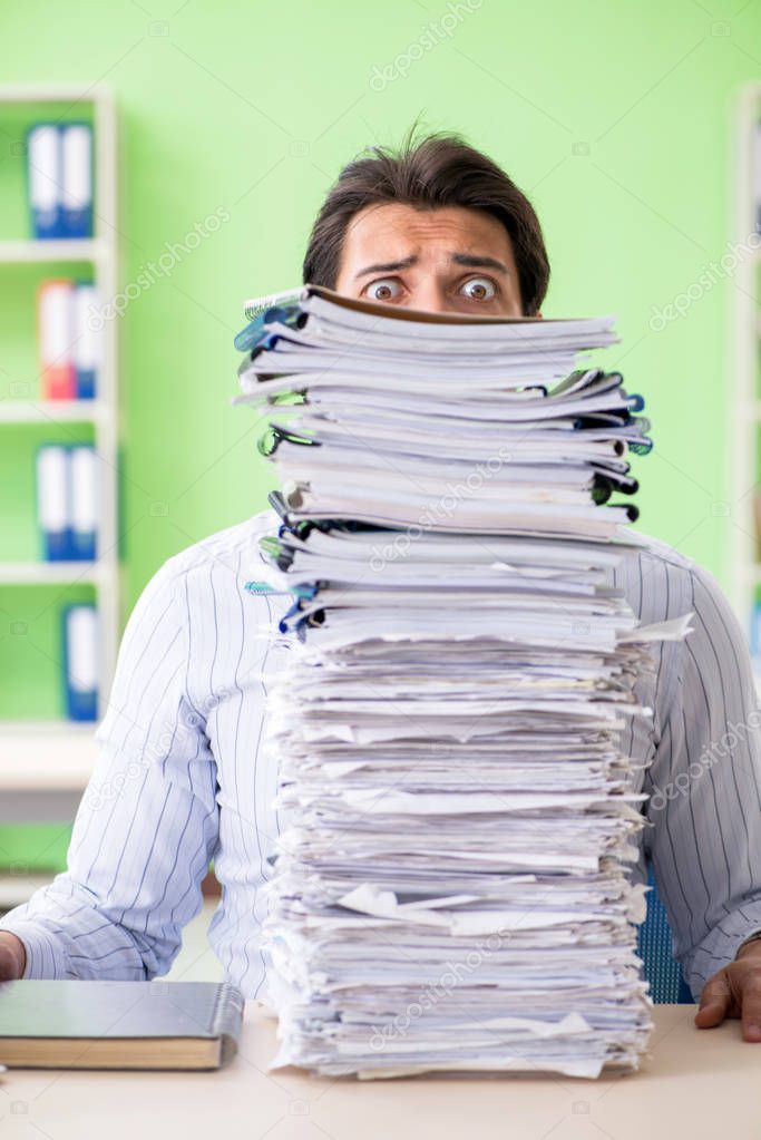 Businessman having problems with paperwork and workload