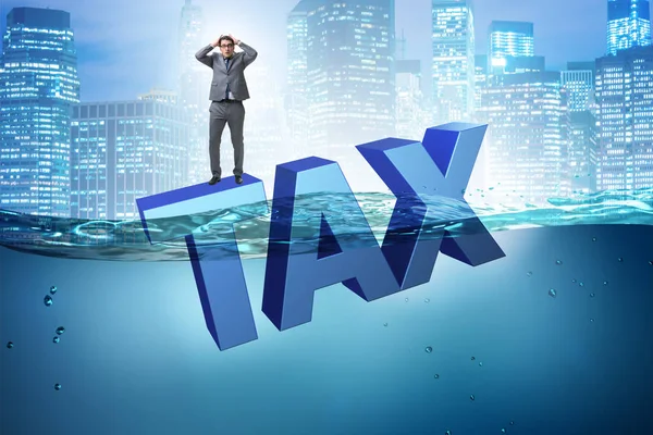 Businessman having problems with paying taxes — Stock Photo, Image