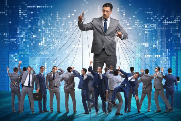 Boss employee manipulating his staff in business concept — Stock Photo, Image