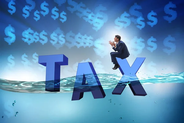 Businessman having problems with paying taxes — Stock Photo, Image