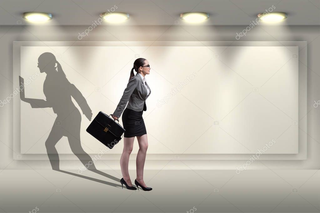 Businesswoman and his shadow in business concept