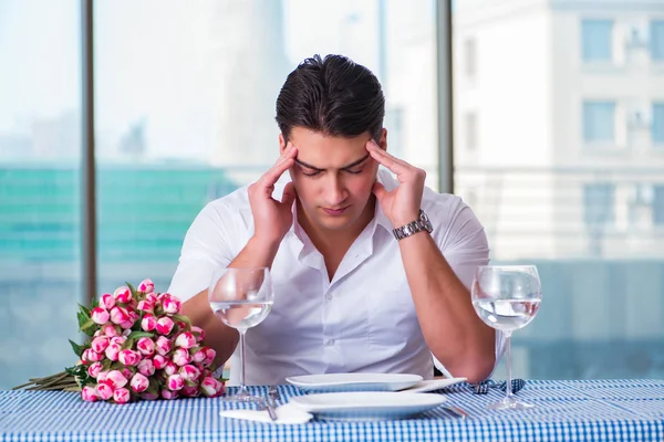 Handsome man alone in restaraunt on date