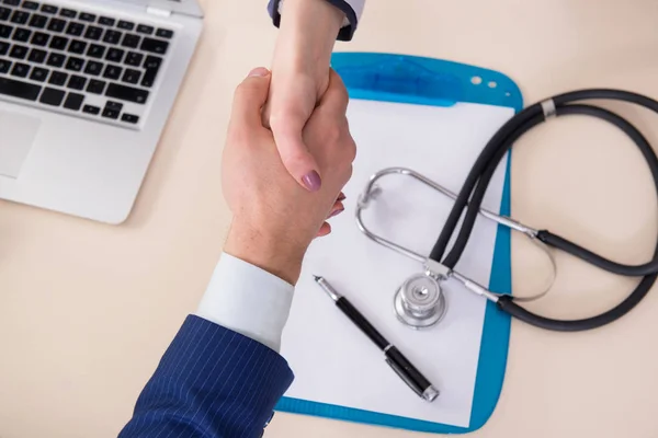 Man signing medical insurance contract