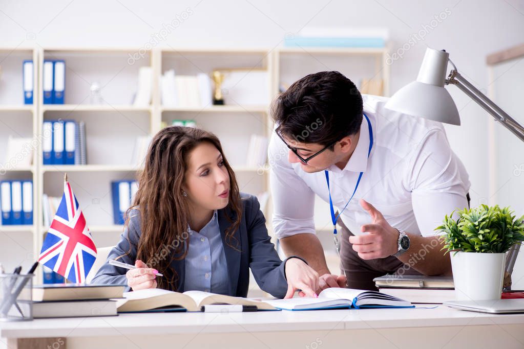 Teacher explaining to student at language training