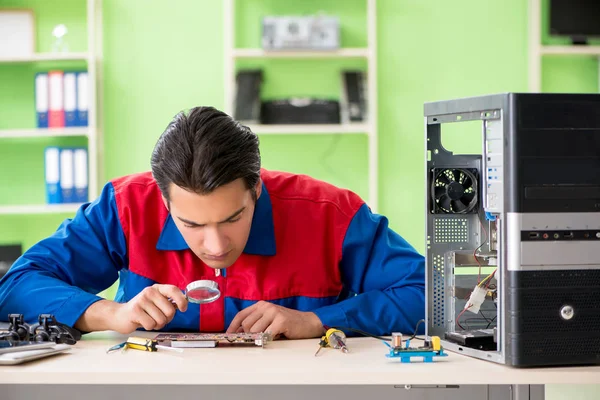 Computer engineer repairing broken desktop