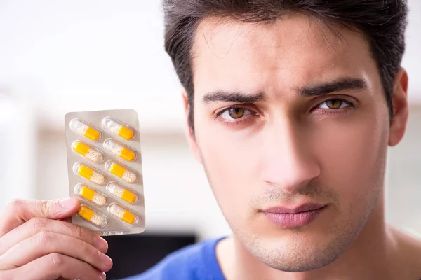 Young handsome man taking care of face skin — Stock Photo, Image