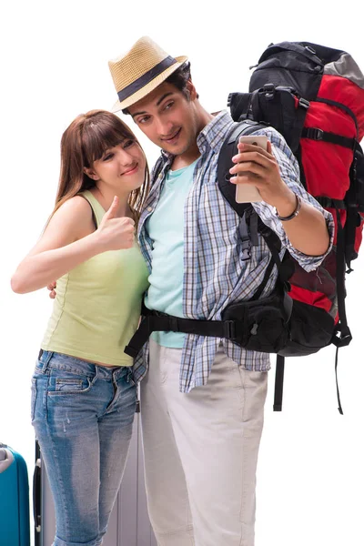 Young family preparing for vacation travel on white — Stock Photo, Image