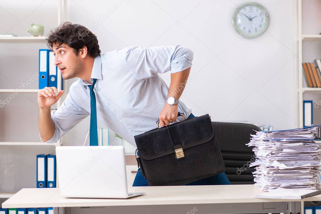 Overloaded busy employee with too much work and paperwork