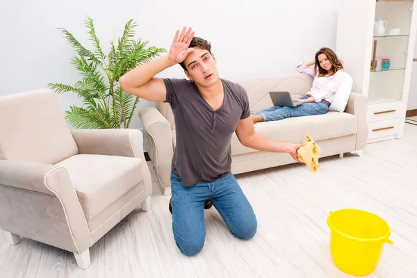 Young family doing cleaning at home — Stock Photo, Image