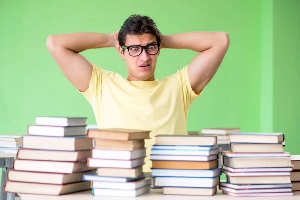 Student with too many books to read before exam — Stock Photo, Image