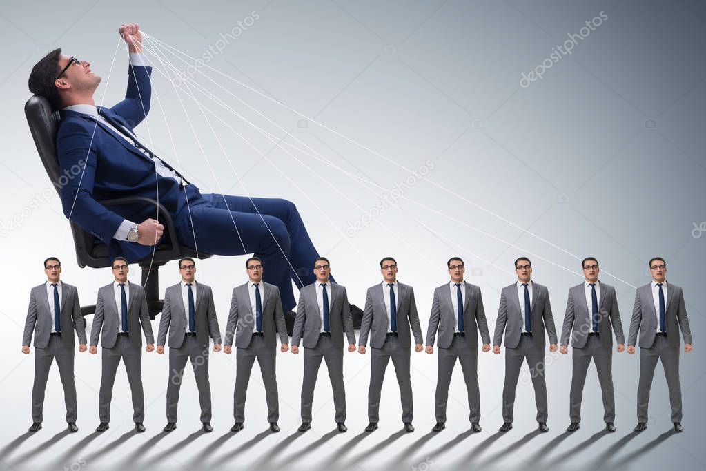 Boss employee manipulating his staff in business concept