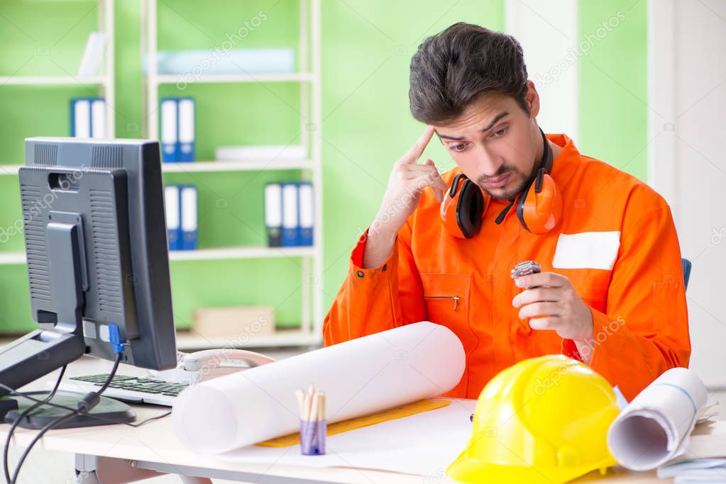 Construction supervisor planning new project in office