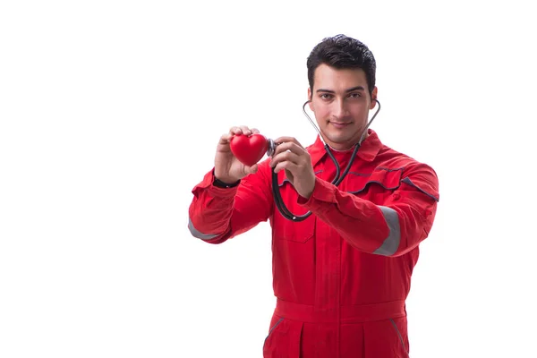 Junger schöner Mann mit Stethoskop und Herz in roter Uniform — Stockfoto