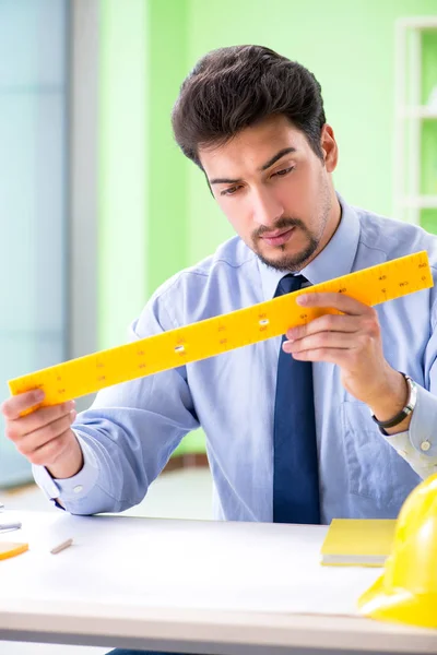 Young male architect working at the project — Stock Photo, Image