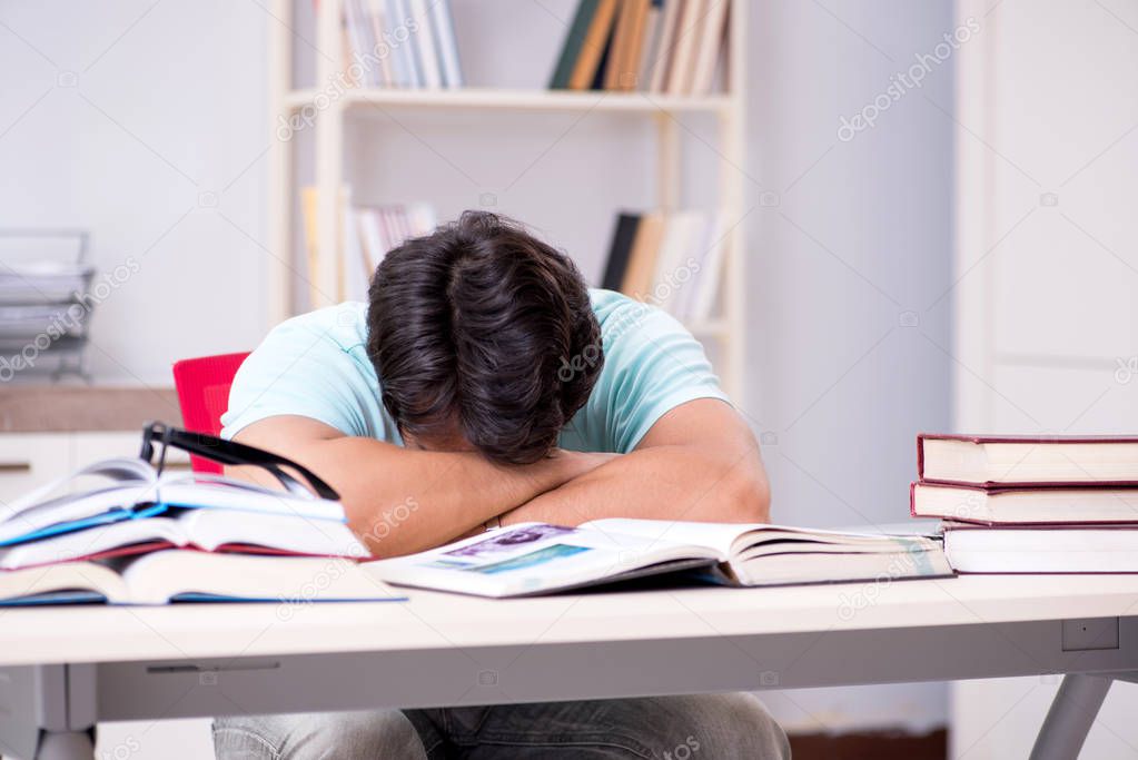 Young handsome student preparing for school exams