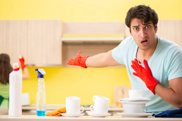 Young couple working at kitchen — Stock Photo, Image