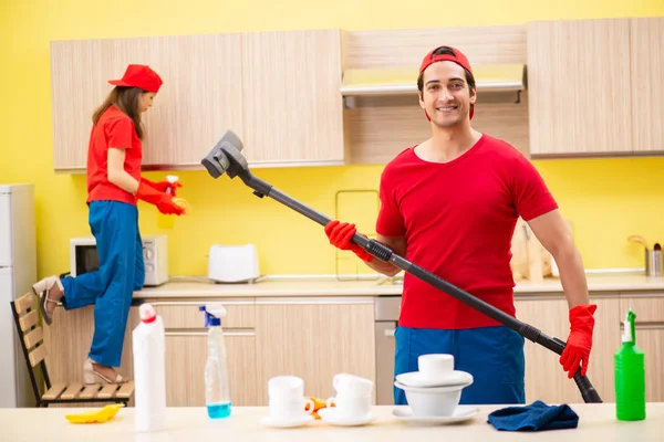 Cleaning professional contractors working at kitchen