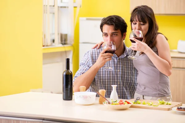 Young couple celebrating wedding anniversary at kitchen — Stock Photo, Image