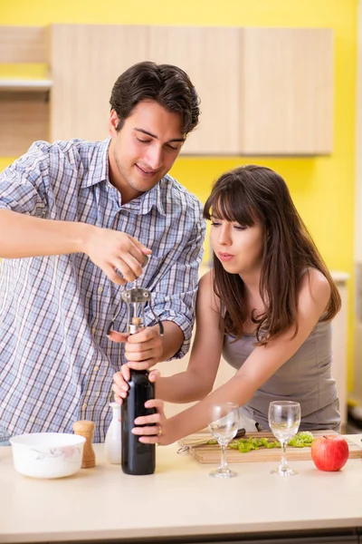 Young couple celebrating wedding anniversary at kitchen — Stock Photo, Image