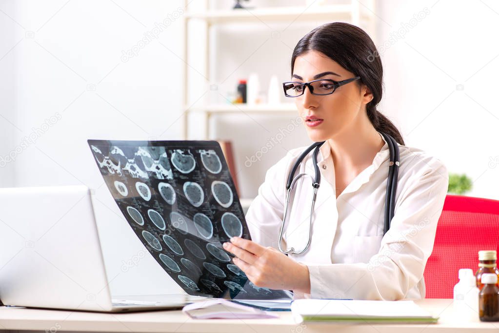 Female doctor radiologist with x-ray can image