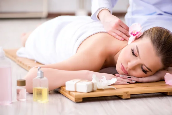 Young woman during spa procedure in salon