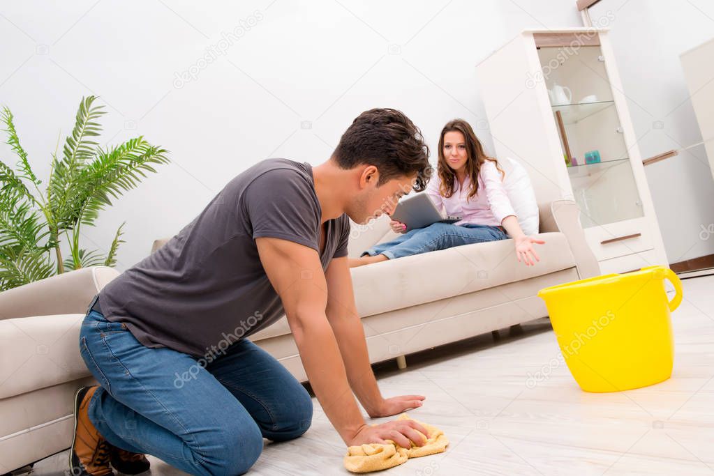 Young family doing cleaning at home