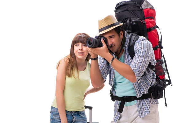 Mladá rodina se připravuje na dovolenou na bílém — Stock fotografie