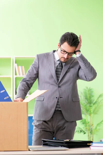 Male employee collecting his stuff after redundancy — Stock Photo, Image