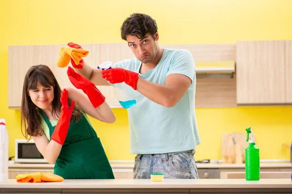 Young couple working at kitchen — Stock Photo, Image