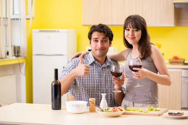 Young couple celebrating wedding anniversary at kitchen — Stock Photo, Image