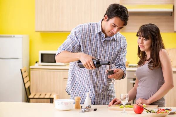 Young couple celebrating wedding anniversary at kitchen — Stock Photo, Image