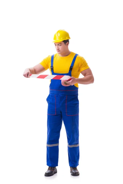 Zabawny pracownik noszący kombinezony z taśmą — Zdjęcie stockowe