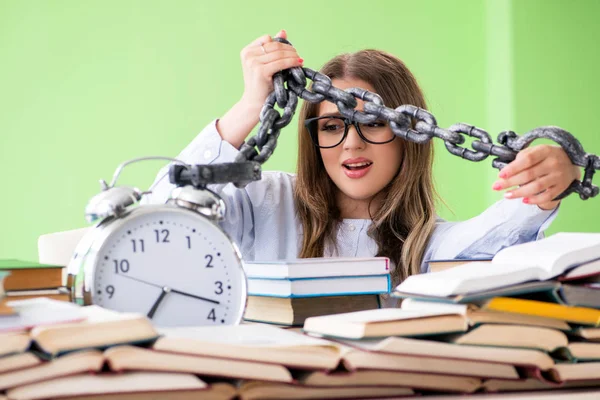 Young female student preparing for exams with many books and cha — Stock Photo, Image