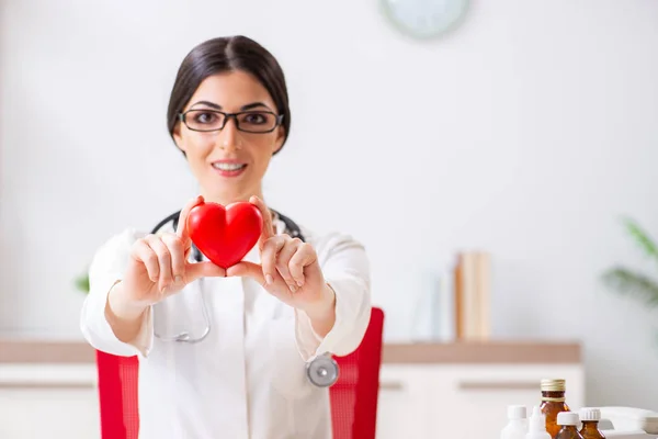 Young doctor in heart care concept — Stock Photo, Image