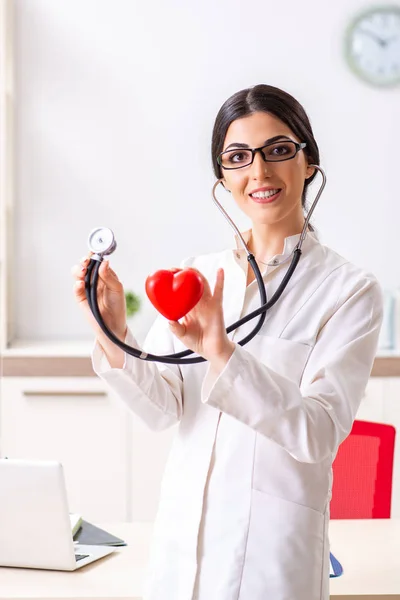 Young doctor in heart care concept — Stock Photo, Image