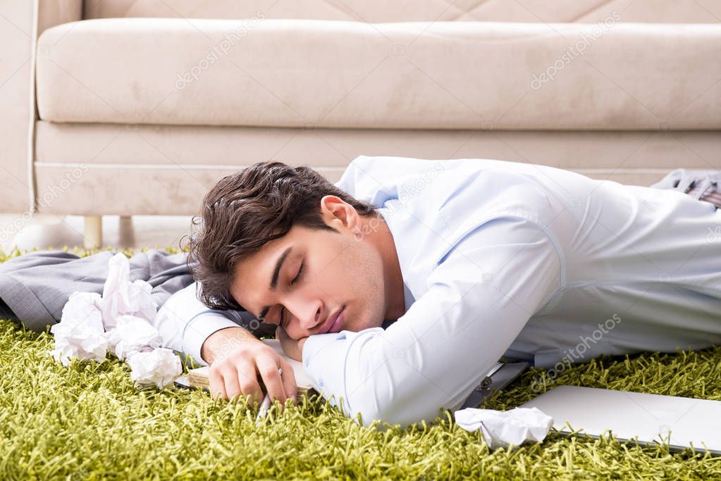 Young handsome man working under startup project at home