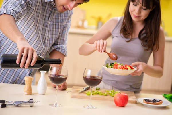 Young couple celebrating wedding anniversary at kitchen — Stock Photo, Image