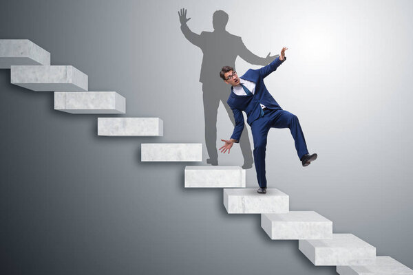 Businessman and his shadow in business concept