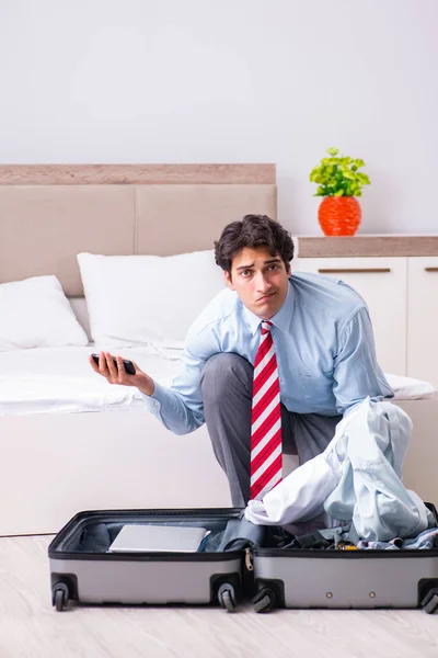 Young handsome businessman preparing for trip — Stock Photo, Image