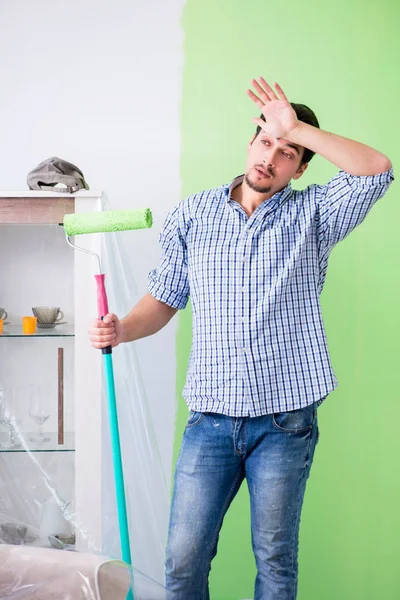 Young painter doing renovation at home — Stock Photo, Image