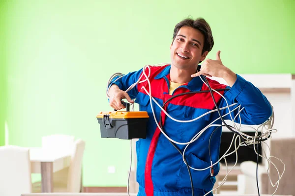 Electrician contractor with tangled cables — Stock Photo, Image